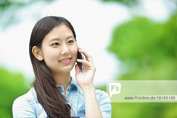 Japanese woman calling on a mobile phone