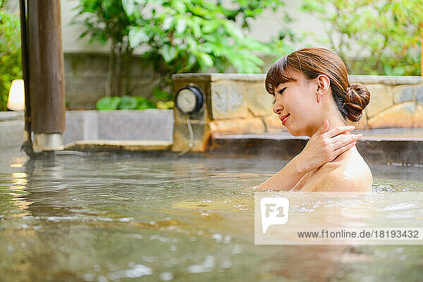 Japanese woman enjoying hot spring