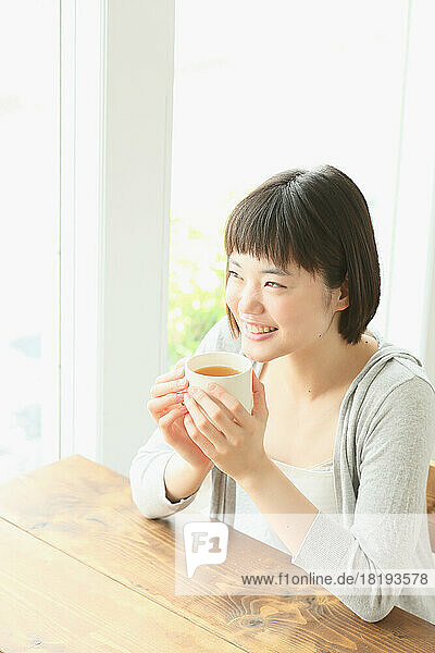 Young Japanese woman drinking tea