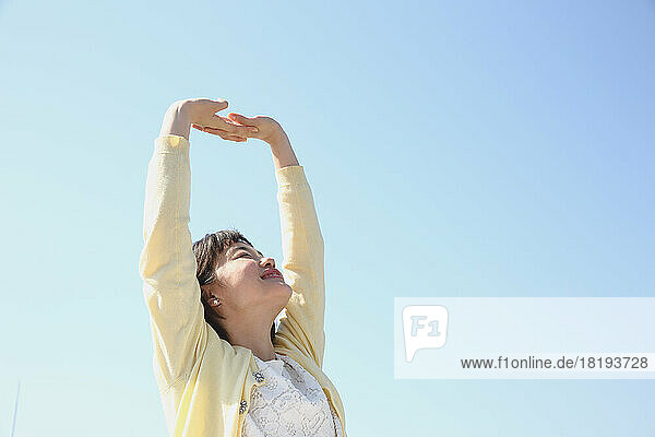 Young Japanese woman under the blue sky