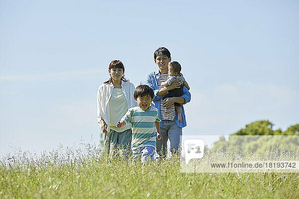 Japanese parents watching over a running child