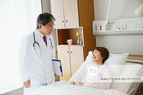 Senior woman being examined by a doctor in a hospital room