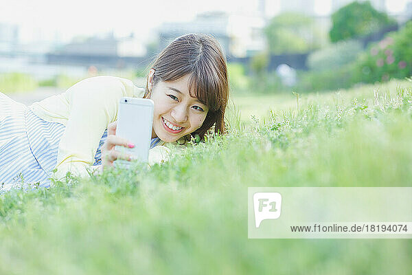 Japanese woman operating a mobile phone