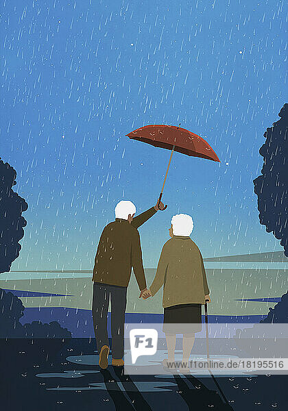 Senior husband holding umbrella over wife in rain
