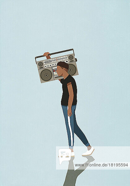 Young man carrying large  retro boom box  listening to music