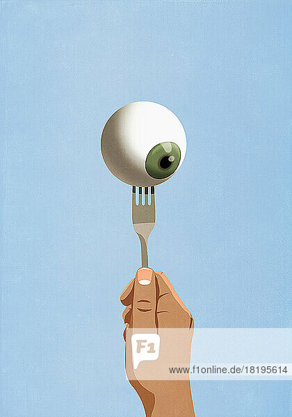 Hand holding fork with eyeball
