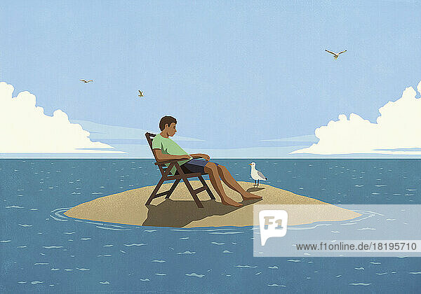 Mann entspannt sich auf einer einsamen Insel im Meer