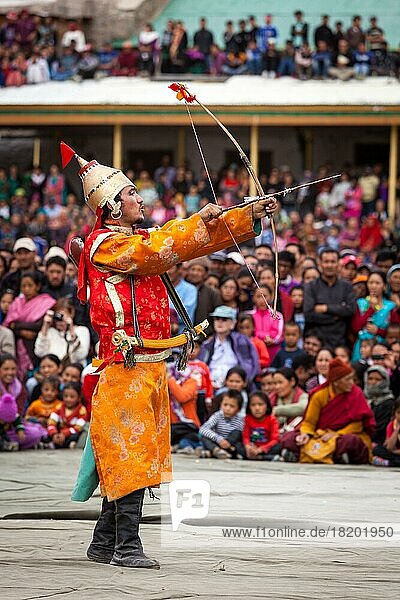 LEH  INDIA  SEPTEMBER 08  2012: Dancers in traditional Ladakhi Tibetan costumes perform warlike dance at the Annual Festival of Ladakh Heritage in Leh  India. September 08  2012
