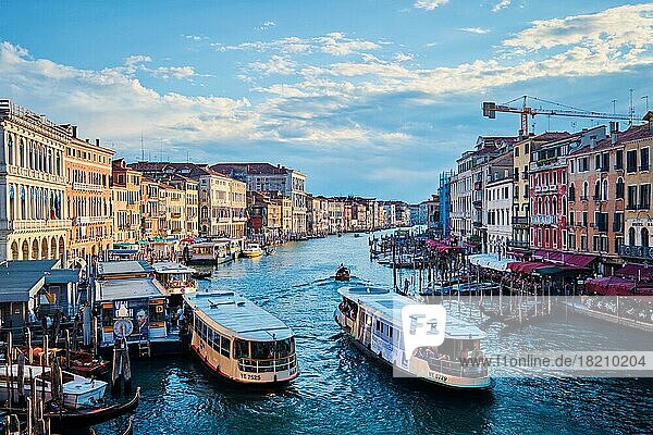 VENICE  ITALY  JUNE 27  2018: Grand Canal with boats  vaporetto and gondolas on sunset from Rialto bridge  Venice  Italy  Europe