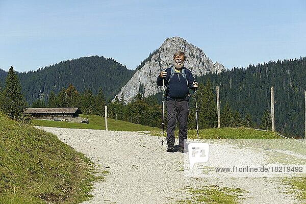 Hiker  senior  63  on the way to Königsalm in front of Leonhardstein  Kreuth  Mangfall Mountains  Upper Bavaria  Germany  Europe