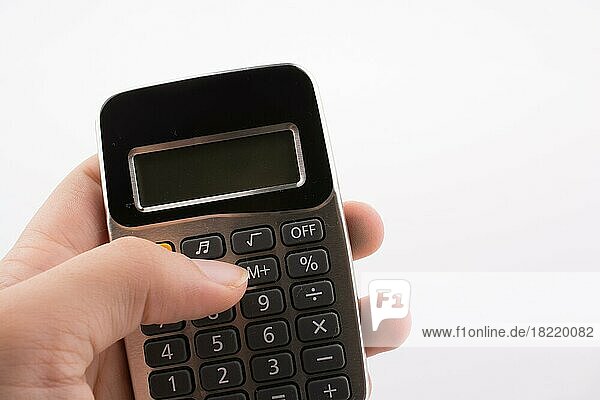 Calculator placed on white background