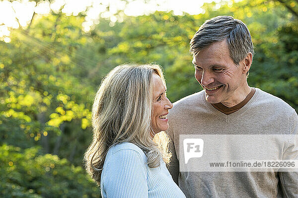 Portrait of happy middle-aged couple having a good time outdoors