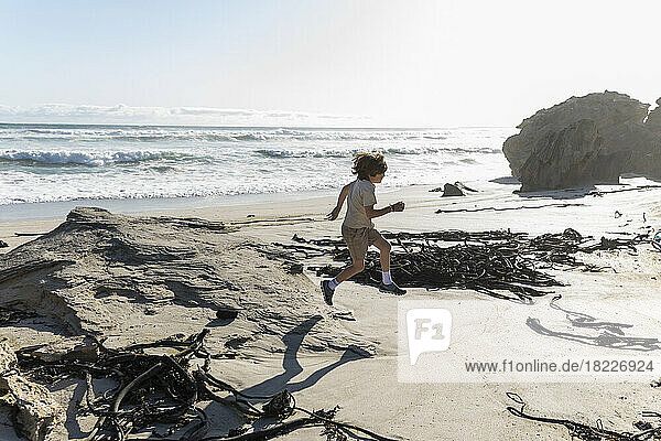 South Africa  Hermanus  Boy (8-9) running on beach