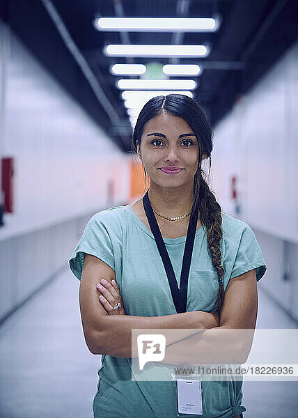 Portrait of smiling female technician in data center