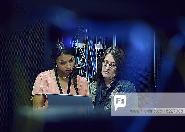 Female technicians working in server room