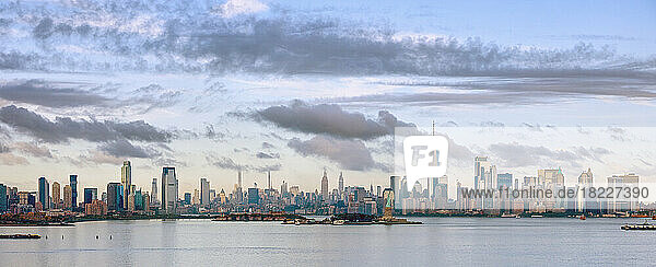 USA  New York  New York City  Panoramic view of city skyline at sunset