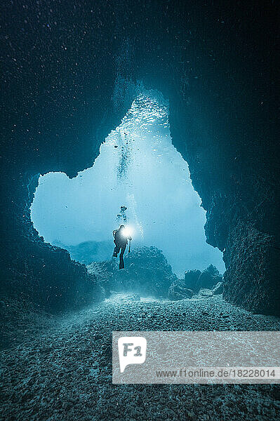 diver exploring underwater cave in the South Andaman Sea