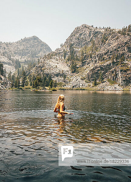 Woman standing in lake
