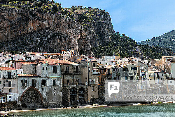 Coastal town with rocky mountain in background  Sicily  Italy