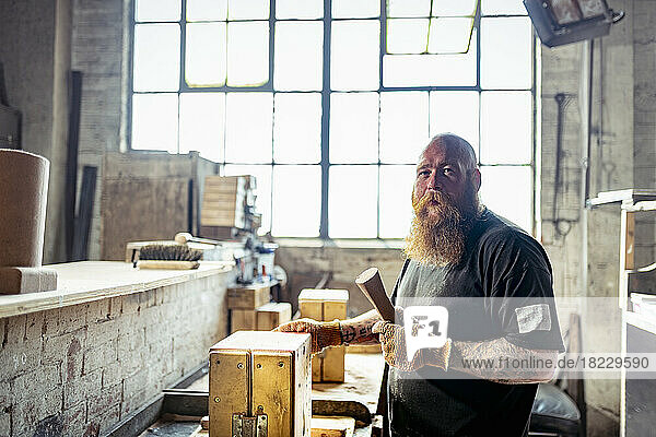 Portrait of mold maker in iron foundry