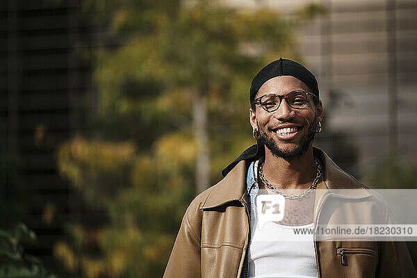 Happy man wearing eyeglasses on sunny day