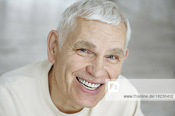 Happy senior man with white hair