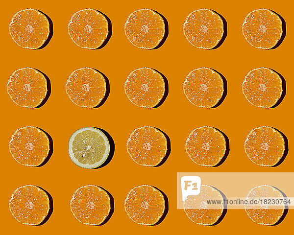Pattern of halved tangerines with single lemon in middle