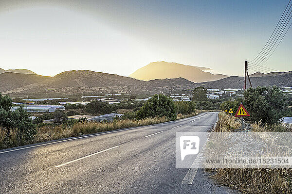 Greece  Crete  Agia Galini  Empty country road at sunset