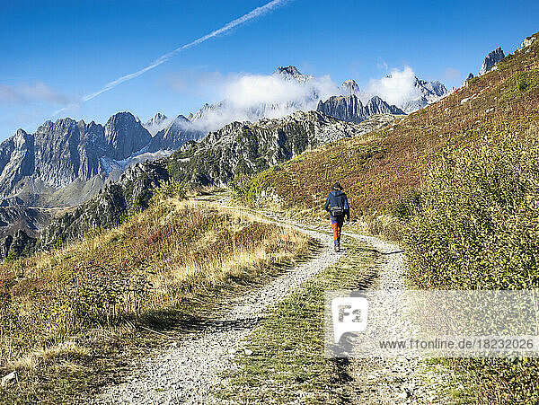 Active senior man hiking on sunny day at Vanoise national park  France