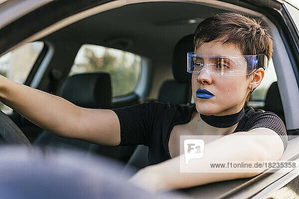 Woman wearing smart glasses driving car