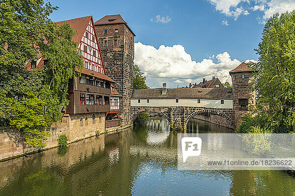 Germany  Bavaria  Nuremberg  View of Pegnitz river flowing through old town with Henkerhaus Museum in background