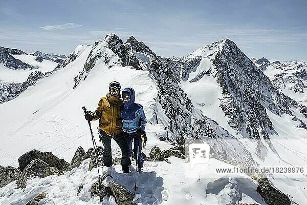 Ski tourers at the summit  Wildes Hinterbergel  mountains in winter with snow  Stubai Alps  Tyrol  Austria  Europe