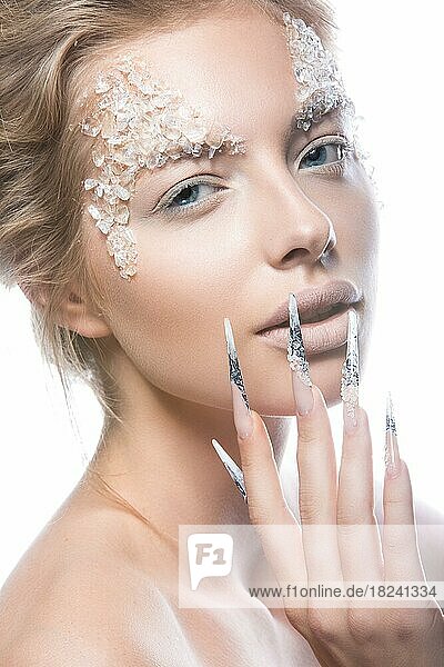 Beautiful fashion model with long nails  creative makeup and manicure design. Beauty face art