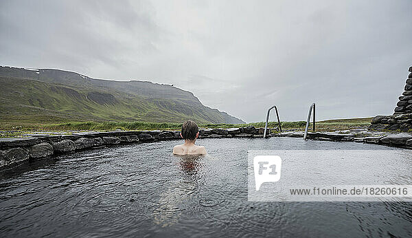 A child in a hot spring in Iceland