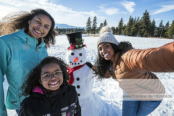 A family building a snowman in Stateline  Nevada.
