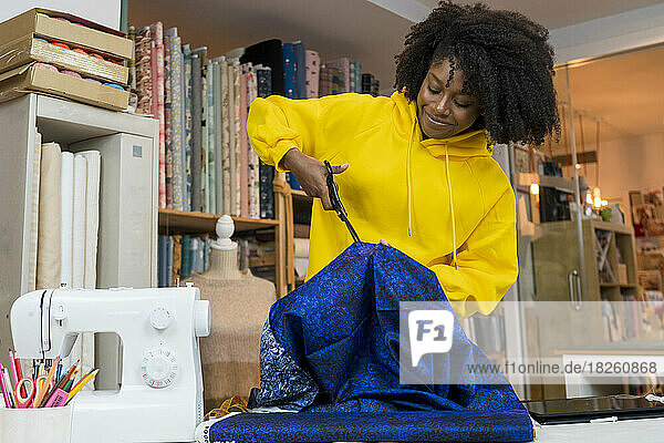 African american girl in her sewing workshop.