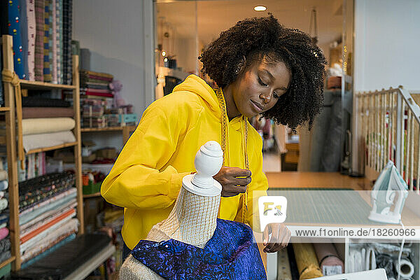 African-American girl in her sewing workshop.