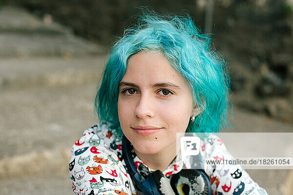 Portrait Of Teen Girl With Blue Hair Wearing A Cat Shirt