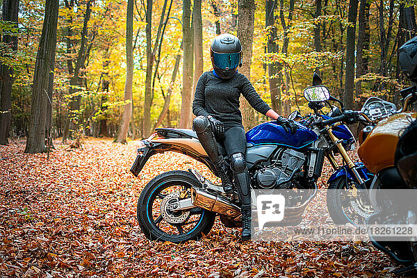 Motorbike girl in a forest journey
