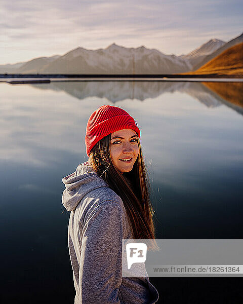 Girl in red hat portrait in mountains near Cristal lake