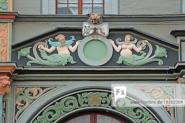 Detail with figures and ornaments at the historical Cranach House  man  woman  mythical creature  coat of arms  Renaissance  market place  Weimar  Deutsche Bank  Weimar  Thuringia  Germany  Europe