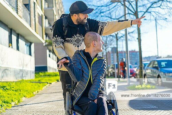 A person with a disability in a wheelchair with a friend walking around having fun  normality for the disabled
