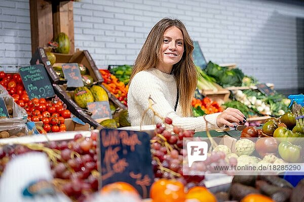 Woman worker of a greengrocer and vegetable food store. healthy and healthy life