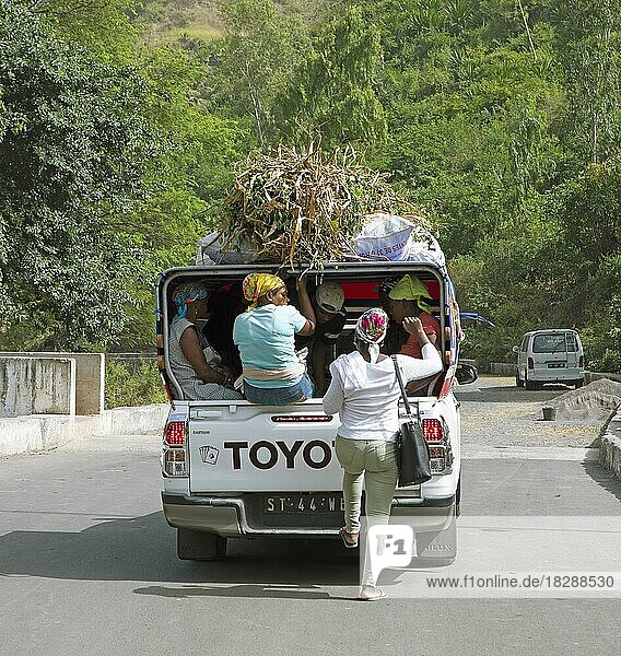 Locals in an aluguer or pickup with roof  harvest lies on the roof  Santiago  Cape Verde  Africa