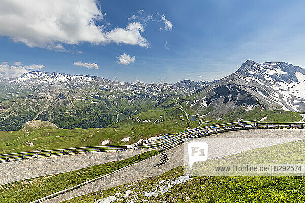 Austria  Carinthia  Person riding bicycle down Grossglockner High Alpine Road