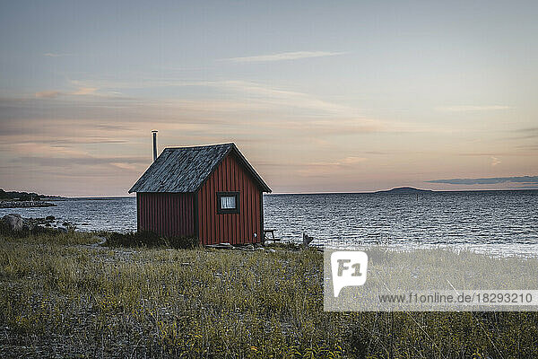Sweden  Oland  Byxelkrok  Lone fishing hut at dusk