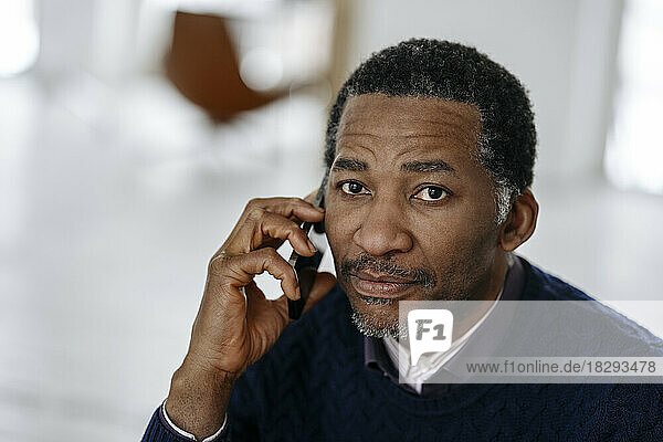 Mature man talking on mobile phone