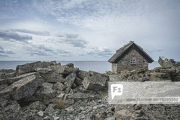 Sweden  Oland  Stone hut on rocky seashore