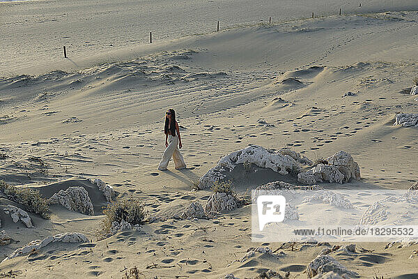 Woman walking on sand at beach  Patara  Turkiye