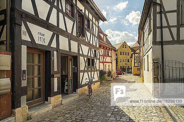 Germany  Bavaria  Forchheim  Half-timbered houses along cobblestone alley in Rosengasschen yawn